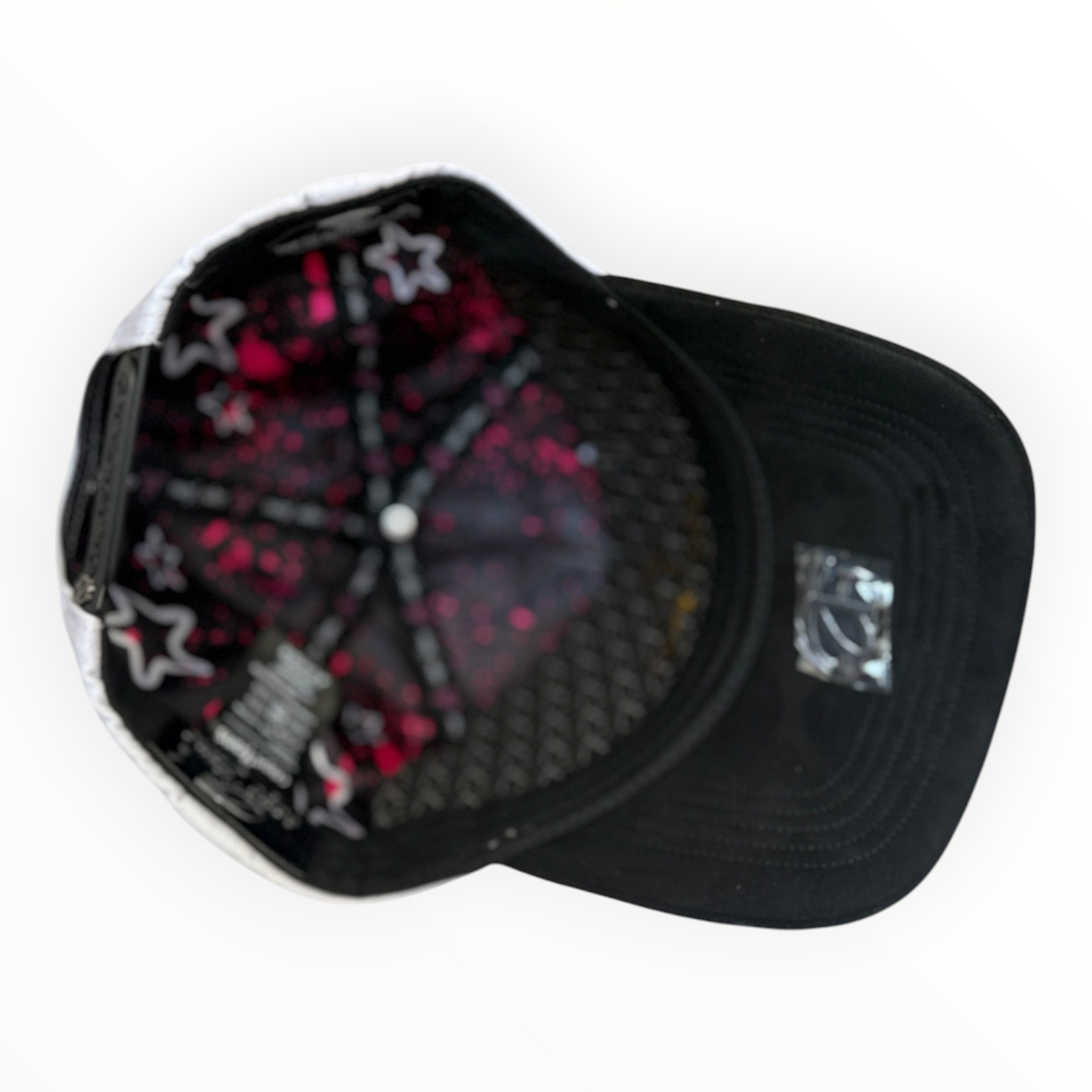 Hype Block baseball cap with black brim, white crown, and pink star-patterned interior lining.