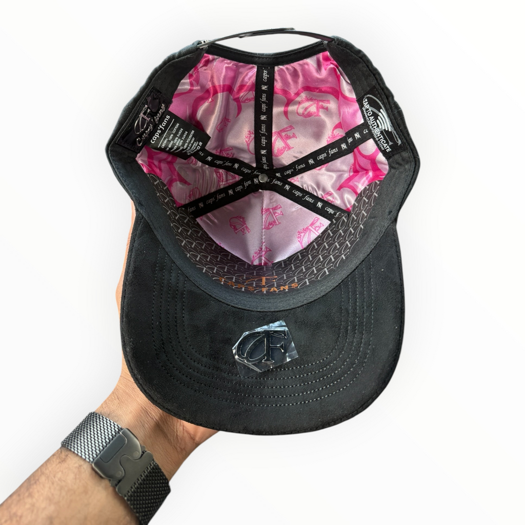 Hype Block baseball cap interior showing pink satin lining with logo print and black structured fabric construction