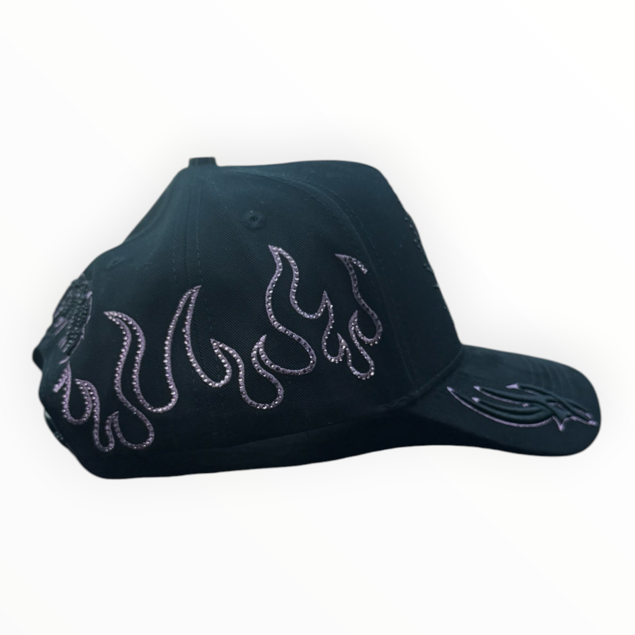 Hype Block black baseball cap with pink rhinestone flame embroidery sitting on a car dashboard