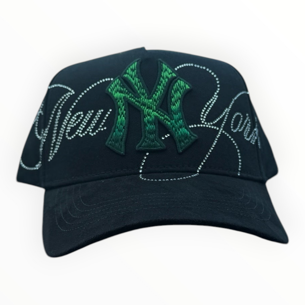Hype Block black baseball cap with green embroidered NY logo and rhinestone New York script on a car dashboard