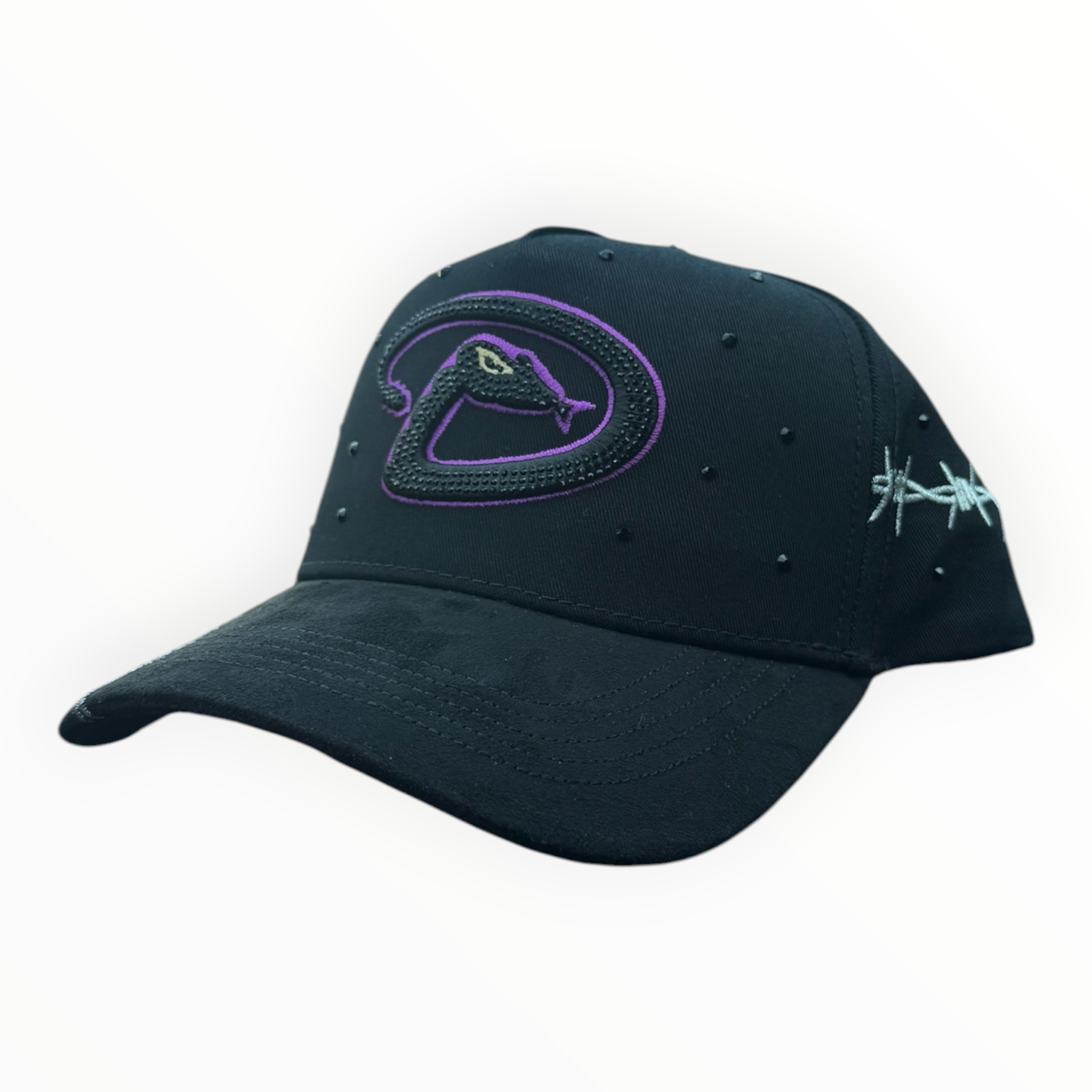 Hype Block black baseball cap with purple snake logo, barbed wire embroidery, and stud details on a car dashboard.
