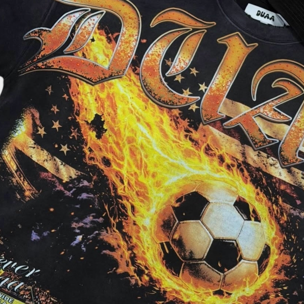 Hype Block DUAA black heavyweight cotton t-shirt featuring a flaming soccer ball graphic and gothic lettering