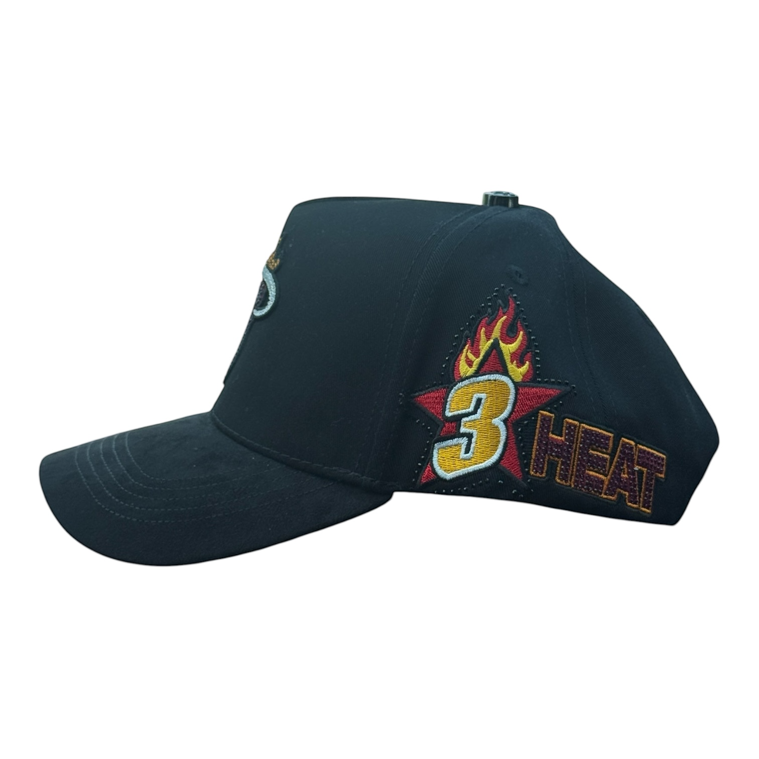 Hype Block Miami Heat black suede snapback cap with crystal logo and embroidered side patch on a car dashboard