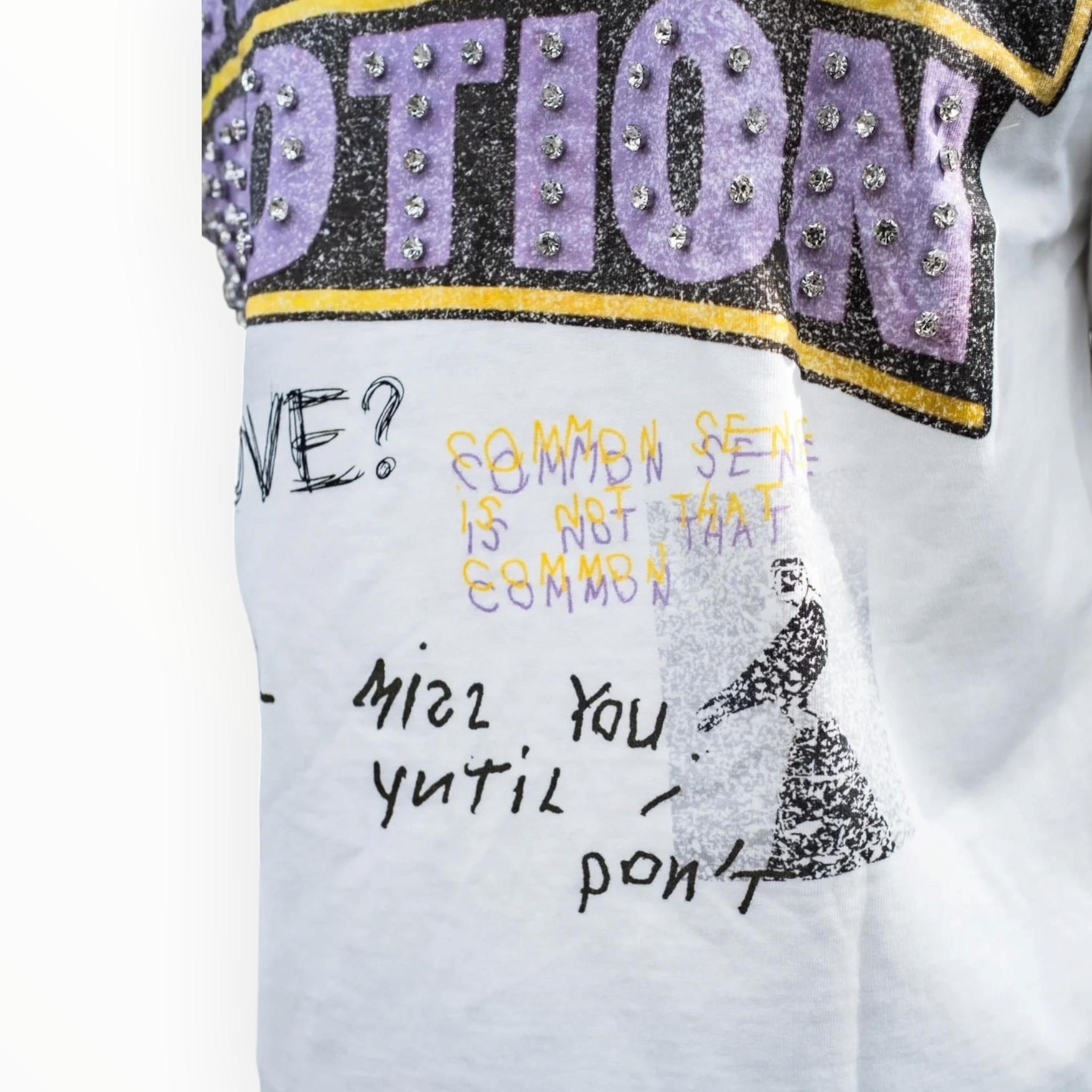 Hype Block white graphic t-shirt featuring rhinestone-embellished lettering and distressed collage-style typography.