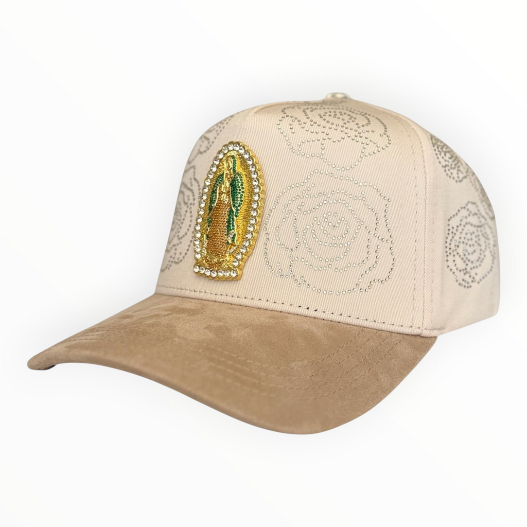 Hype Block beige baseball cap with rhinestone rose patterns, gold Virgin of Guadalupe emblem, and tan suede brim.