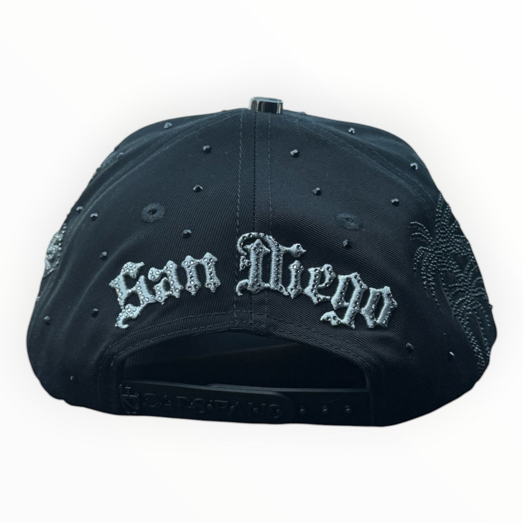 Hype Block black San Diego Padres snapback cap featuring rhinestone San Diego lettering and side palm tree detailing.