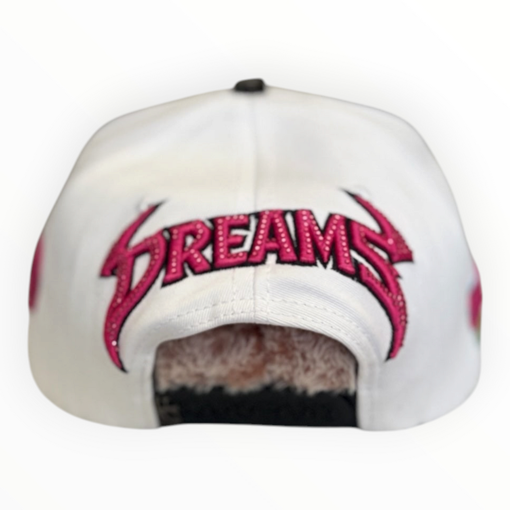 Hype Block white baseball cap featuring pink glittery Dreams embroidery and rhinestone accents on the back